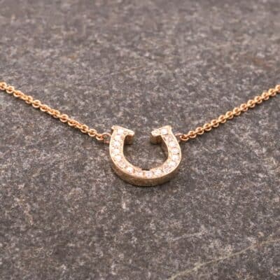 Hufeisen Collier in 585er Rosegold mit Brillanten