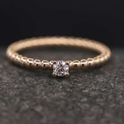 Verlobungsring Kugelring 585er Rosegold mit 0,11ct synthetischem Diamanten im Brillantschliff